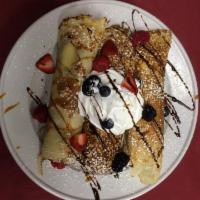 Berries and Cream Crepes · 3 Crepes rolled with fresh berries and whipped cream topped with powder sugar