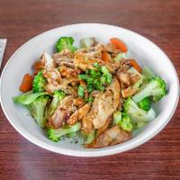 14. Teriyaki Chicken Bowl · Teriyaki chicken with steamed broccoli, cabbage, and carrots on top of rice with teriyaki sa...