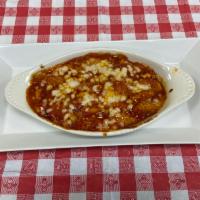 Gnocchi Sorrentina · Baked gnocchi with mozzarella and tomato sauce.