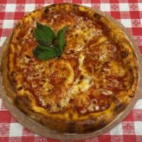 Pizza Margherita · Served with tomato sauce, mozzarella and basil.
