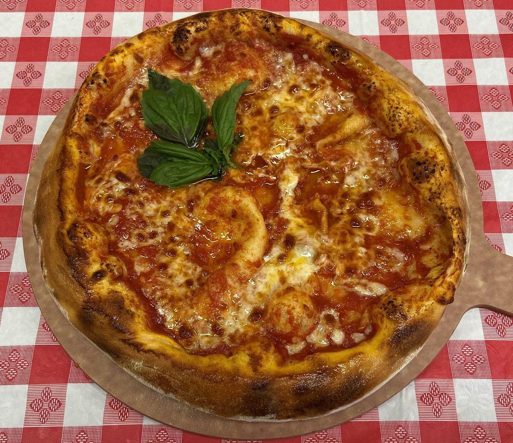 Pizza Margherita · Served with tomato sauce, mozzarella and basil.