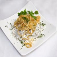 4. Tashkent Salad · Beef tongue, white radish, crispy onions and greens, and dressed with white sauce.