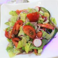 9. Navruz Salad · Tomatoes, cucumbers, onions, lettuce, and greens, dressed with lemon juice and olive oil.