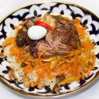 2. Uzbek Plov · Beef, lamb, rice, and carrots. Plus, salad and quarter bread included.