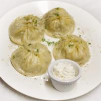 4. Pumpkin Manti · 4 pieces. Steamed dumplings with chopped pumpkin and onions, served with kefir cheese.