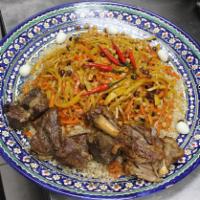 12. Chayhona Plov · Beef, lamb, rice, carrots, chickpeas, and raisins.