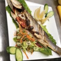 15. Grilled Bronzini · Served with vegetables.