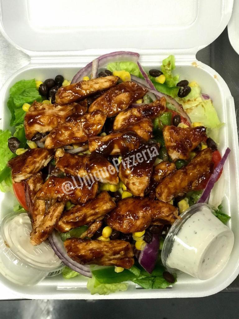 BBQ Chicken Salad · Romaine lettuce, chicken breast, bell peppers, onions, tomatoes, corn and black beans with ranch dressing.
