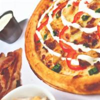 Chicken Bacon Ranch Pizza · Ranch sauce, mozzarella, grilled chicken, bacon, red peppers, green onions and ranch swirl.
