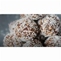 Rush Bites Coconut · Fresh Ground peanut butter, chocolate chips, oats, coconut and honey rolled in coconut. 4 pe...