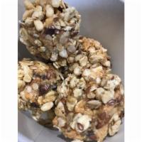 Rush Bites Granola · Fresh Ground peanut butter, chocolate chips, oats, coconut and honey rolled in granola. 4 pe...