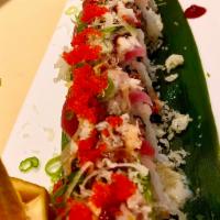 S22. Pink Lady Roll · Spicy crunchy tuna topped with tuna sliced lemon, crunchy, scallion, fish eggs and dynamite ...