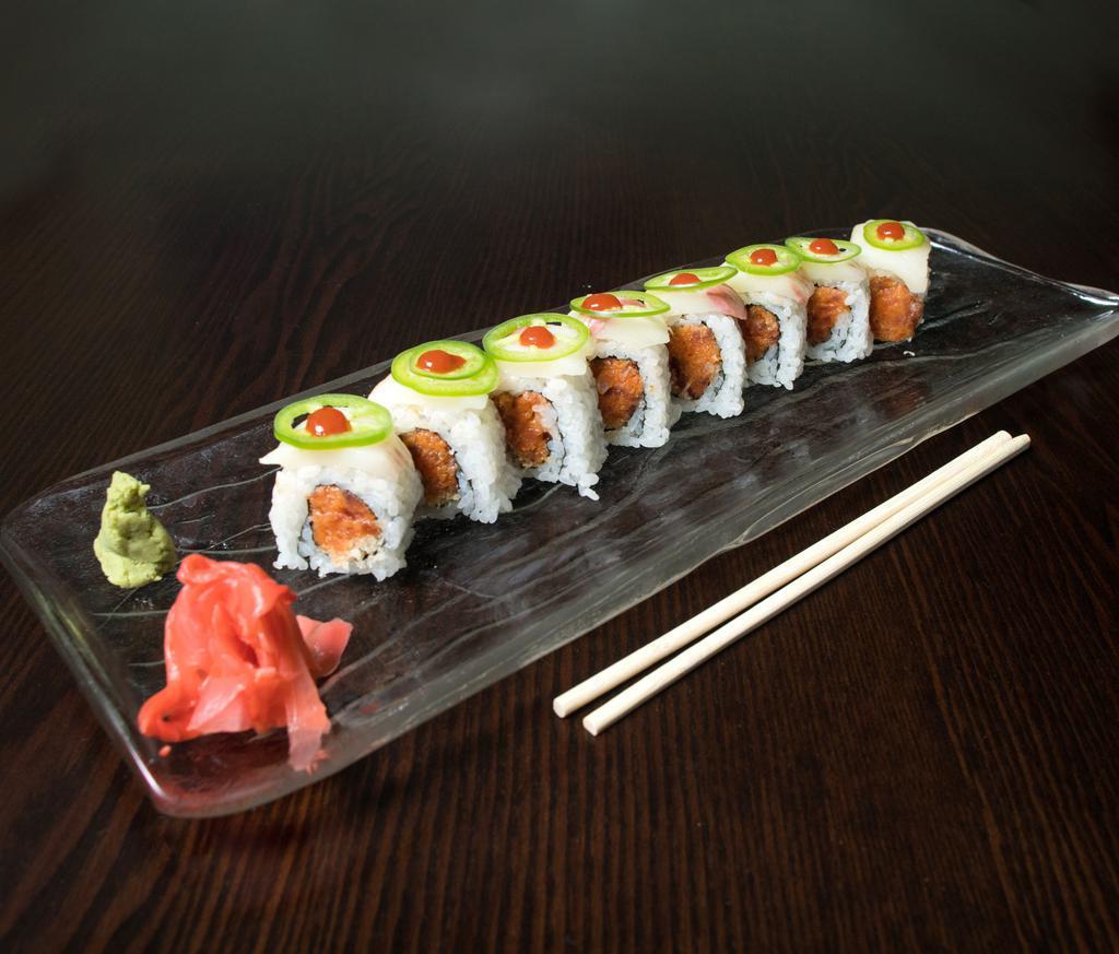 S29. Jalapeno Roll · Spicy crunchy tuna,avocado topped yellowtail and jalapeno hot sauce.