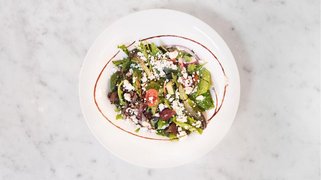 Greek Salad · Mixed greens, baby spinach, grape tomatoes, feta, Kalamata olives, red onions, cucumbers. Tossed in Italian dressing.