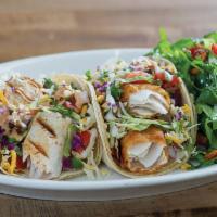 Wild Caught Fish Taco Plate · 2 tacos. Cabbage, cheese, pico de gallo and sauce. Served with choice of tortilla and side.