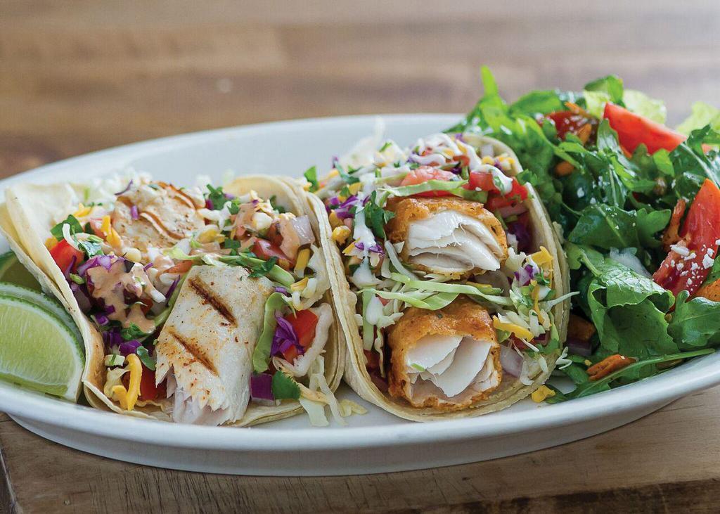 Wild Caught Fish Taco Plate · 2 tacos. Cabbage, cheese, pico de gallo and sauce. Served with choice of tortilla and side.