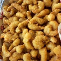 Popcorn Shrimp & Chips · French fries included.