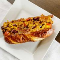 Chili Dog · 1/4 lb. Vienna Beef on Freshly Baked Pretzel Bun - Diced Onions - Home-made Chili Topped wit...
