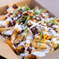 Loaded Fries · Comes with bacon, Colby jack, scallions and avocado ranch.