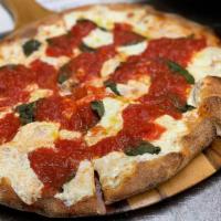 Margherita Pizza · Red pie. San Marzano tomatoes, fresh basil, fresh mozzarella, evoo
