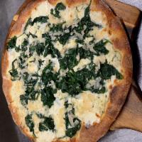 Spinach Ricotta Pizza · White pie. Sautéed spinach & garlic, herb fresh ricotta, Parmigiano Reggiano