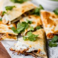 Pork Carnitas Quesadilla · Savory, house smoked pulled pork, tomatoes and mozzarella cheese. Pressed and grilled in a c...