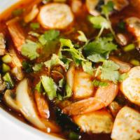 TOM YUM DINNER  · Spicy combination of herbs, mushrooms, tomatoes, cilantro, lemongrass, galangal roots and ch...