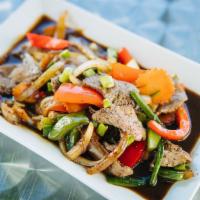 PEPPER STEAK DINNER  · Tender beef slices sauteed with sweet onions, carrots, scallions and bell pepper in a tangy ...