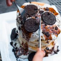 Oreo’s and Cream Pancakes · Crushed Oreos sprinkled in a short stack of pancakes and topped with sweet cream frosting an...