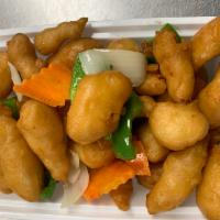 Sweet and Sour Chicken · Lightly battered chicken with tossed in sweet and sour sauce. Served with rice.