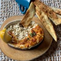 Dungeness Crab Dip · Fresh crab & artichoke hearts with a blend of melted cheeses. Served with house made crackers