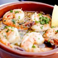Spicy Garlic Prawns · Sautéed in sherry wine & red pepper flakes. Served w/toasted bread