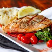 Mediterranean King Salmon* · Fresh King salmon, sautéed greens, cherry tomatoes & garlic mashed potatoes w/a  herb lemon ...