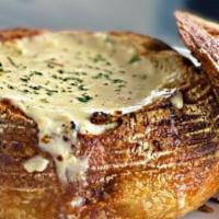 Clam Chowder Bread Bowl · A traditional, creamy New England clam chowder w/fresh clams. Served in a rustica bread bowl