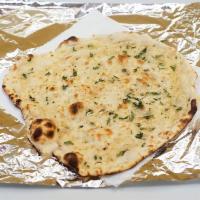 Garlic Naan · Naan with a touch of garlic and spices.