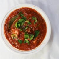 Lamb Curry · Lamb cooked in a blend of onions, tomatoes and spices. Served with rice.