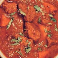 Lamb Vindaloo · Lamb cooked with potatoes in spicy vinegar based sauce. Served with rice.