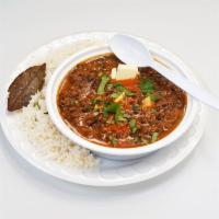 Dal Makhini · Lentils cooked with fresh herbs and spices. Served with rice. 