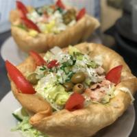 Taco Salad · Served with grilled chicken or grilled steak on a crispy tortilla bowl with refried beans an...