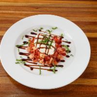 Buratta · Cream filled fresh mozzarella over tomato salad and topped with fresh basil, balsamic glaze ...