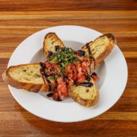 Bruschetta · Grilled garlic toast topped with seasoned tomatoes, red onion, fresh basil and balsamic glaze.