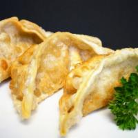 Gyoza Dumplings · Chicken and vegetable potstickers soy based sauce (steamed or fried). 6 pieces.