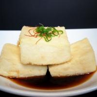 Agedashi Tofu · Deep-fried tofu ginger sauce. 4 pieces. Vegetarian.