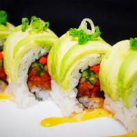 911 Roll · 8 pieces. Spicy tuna, carrots, cucumber topped with avocado, green onion, and spicy dressing...