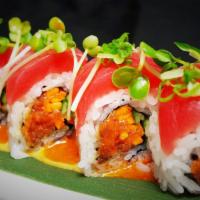 Hawaiian Roll · 8 pieces. Spicy tuna, cucumber, carrots topped with tuna, sprouts, and spicy dressing. Spicy.