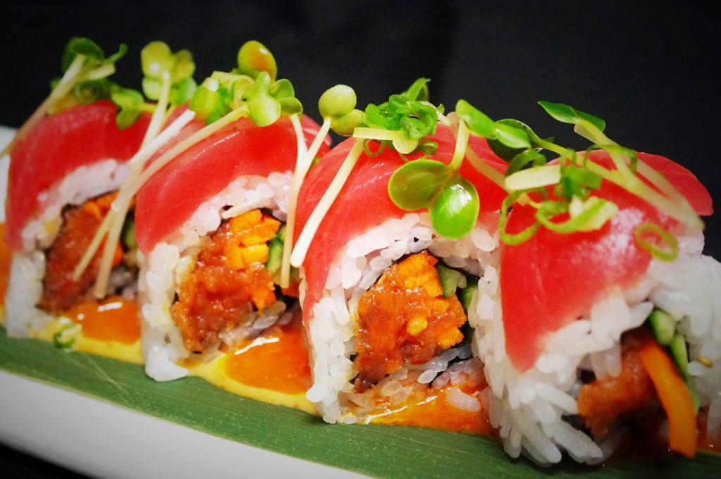 Hawaiian Roll · 8 pieces. Spicy tuna, cucumber, carrots topped with tuna, sprouts, and spicy dressing. Spicy.