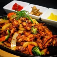 Spicy Chicken · 9 oz. chicken breast marinated in a sweet toy, vegetables, and spicy sauce. Served with side...