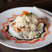 Q18. Volcano Roll · Snow crab, cream cheese topped with spicy crawfish, crunchy and masago, spicy mayo, eel sauce.