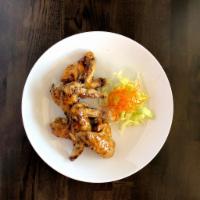Lemongrass Signature Wings (4) · Whole chicken wings marinated and deep-fried, seasoned with Thai chili powder.