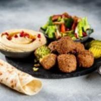 Falafel Platter · 6 pieces of our Vegan gluten free Falafel, hummus, fresh salad, and Tahini sauce. Vegan. Glu...